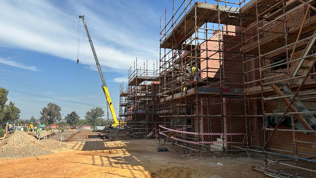 Crane and scaffolding during top-structure construction