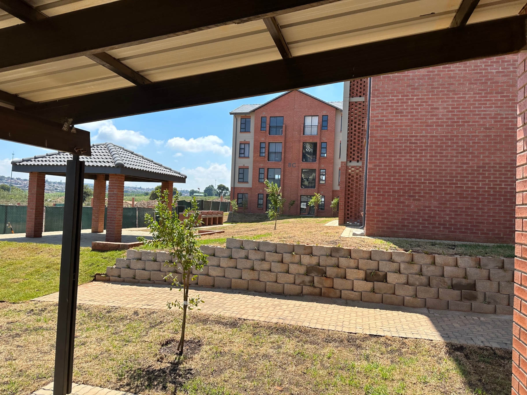 Communal lapa and lawn area within the estate